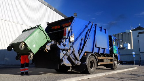 Business professionals managing waste in East London office