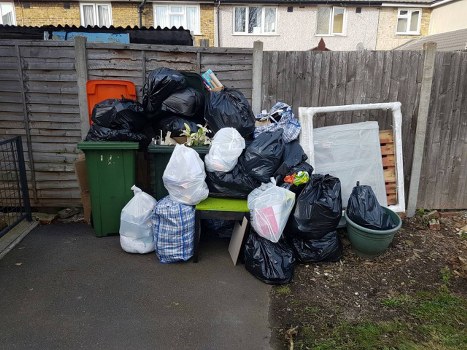 Rubbish removal truck unloading in East London