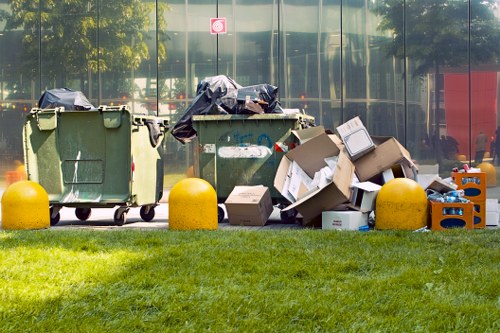 Professionals performing flat clearance in a modern East London apartment